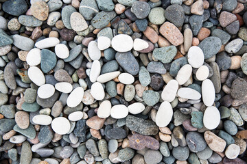Sea gray stones. Background from sea. Wet gray stones for design.White pebble inscription Sea.
