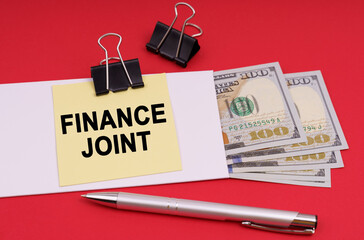 On a red background, an envelope with money and a sticker with the inscription - FINANCE JOINT