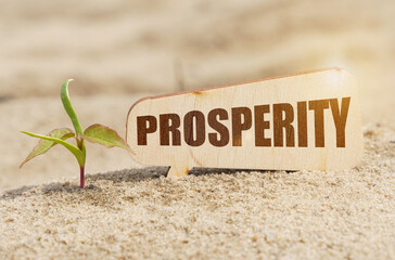 Near the sprout there is a plate with the inscription - PROSPERITY