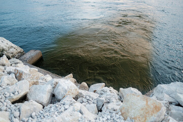 Dirty waste gets into the water. Wastewater pollution of sea ecosystem.