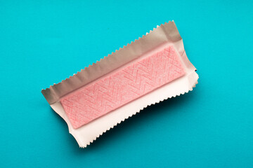 Pink chewing gum plate unfolded from the foil package - obrazy, fototapety, plakaty