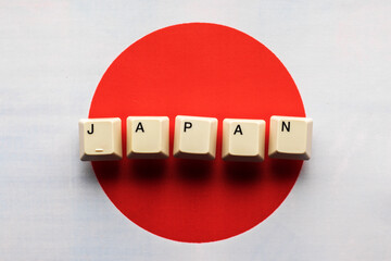 The country name Japan consists of keyboard keys in front of the national flag of Japan.