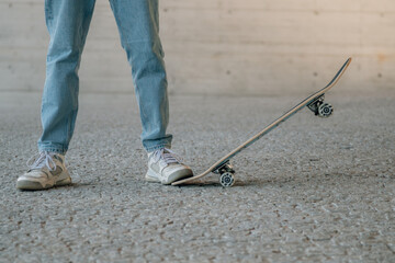 Fototapeta na wymiar closeup of feet of young man with skateboard