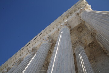 Worm's eye view of marble columns on Supreme Court