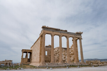 Remains of ancient marble temple on Acropolis hill in Athens, Greece. The Erechtheion, ancient...