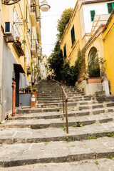 Fototapeta na wymiar Stairs climbing the medieval alleys in the city of Naples Italy.