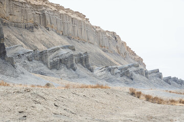 The dry, desolate desert landscape along Utah State Route 24 in daylight.