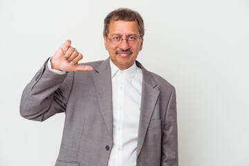 Middle aged indian business man isolated on white background showing a dislike gesture, thumbs down. Disagreement concept.