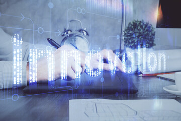 Multi exposure of man's hands holding and using a digital device and data theme drawing. Innovation concept.