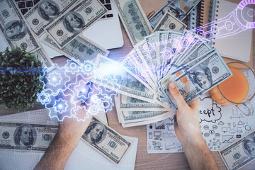 Multi exposure of technology drawing hologram and us dollars bills and man hands. Data concept