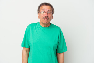 Fototapeta premium Middle aged indian man isolated on white background sad, serious face, feeling miserable and displeased.