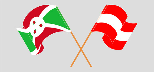 Crossed and waving flags of Burundi and Austria