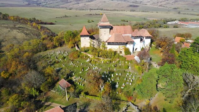 Aerial view of Viscri village in Transylvania - Saxon stone-walled church in Romania, Eastern Europe.