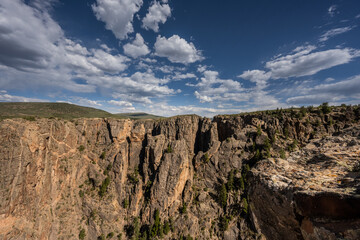 Puffy Clouds Float Across the Sky Over Black Canyon of the Gunnison