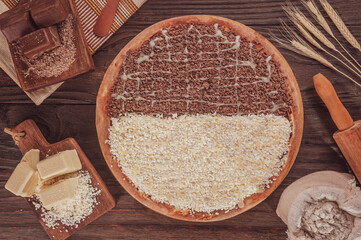 Brazilian sweet pizza half chocolate and half white chocolate with condensed milk. (Pizza meio a...