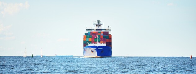 Large cargo container ship sailing from Europoort (Rotterdam, Netherlands) in an open sea on a...