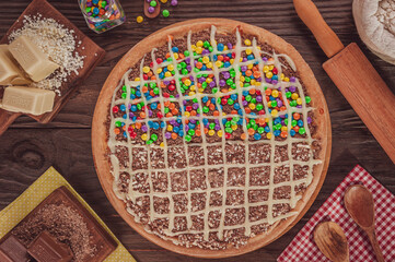Brazilian sweet pizza half milk cream, chocolate, confectionery and condensed milk,