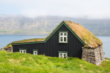 Fototapeta na wymiar Old renovated farmhouse in Skotufjordur in Isafjardardjup in Iceland