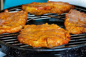 Pieces of meat are grilled