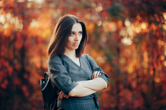 Upset Woman Standing with Arms Crossed