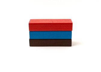 Multicolor toy wooden blocks isolated on white background.