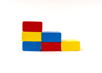 Multicolor toy wooden blocks isolated on white background.