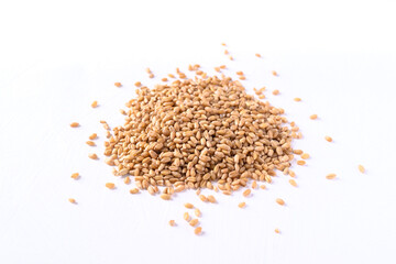 Pile of wheat grain on white background