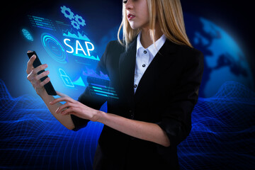 Business, Technology, Internet and network concept. Young businessman working on a virtual screen of the future and sees the inscription: SAP
