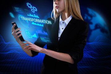 Business, Technology, Internet and network concept. Young businessman working on a virtual screen of the future and sees the inscription: Transformation