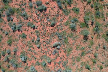 Outback Australia aerial drone wide shot over the picturesque wild rural dry red center desert...