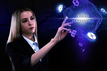 Business, Technology, Internet and network concept. Young businessman working on a virtual screen of the future and sees the inscription: Video marketing