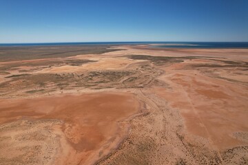 Outback Australia aerial wide shot over the picturesque dry drought affected river lake environment...