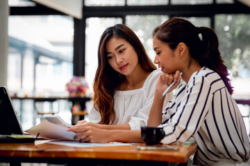 Portrait of Professional asian business team working together at desk,