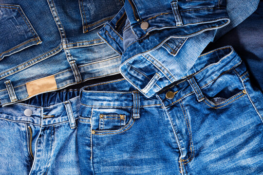 blue jeans background overlapping Modern fashion jeans - top view