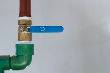 Water industrial tap on pipeline on white background and copy space.