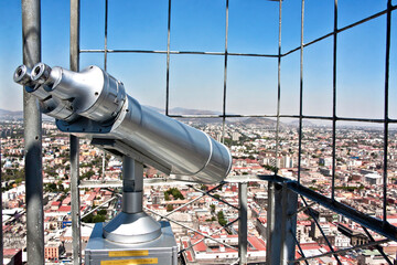 Tourist telescope with panoramic view of Mexico City, old metal binoculars at the viewpoint of the...