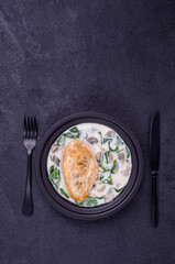 Fried bird breasts with stewed vegetables