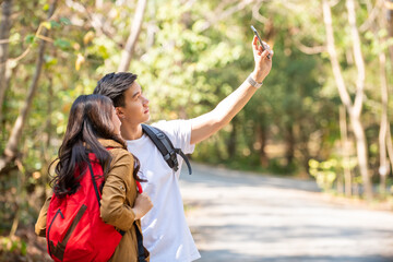 Naklejka premium adventure, asian, backpack, beautiful, beauty, boyfriend, camping, climbing, couple, enjoy, family, female, forest, freedom, fresh, friend, girl, girlfriend, happy, hiker, hiking, hill, holding hands,