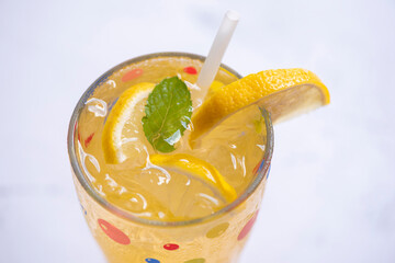 Summer drink juicy lemon slice, Exotic summer drinks refreshing of cold drinks glasses fresh fruit on ice homemade cocktail tea with lemon and mint leaf