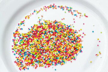 colorful sprinkles on white plate