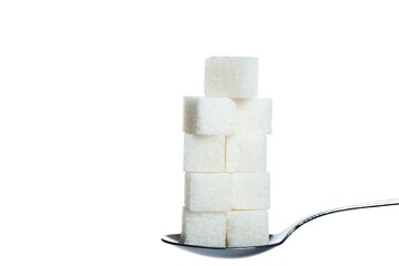 Spoon full of sugar cubes