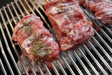 Pork BBQ tenderloin steak sprinkled with herb powder.