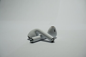  a wireless earphones on a white background, 
