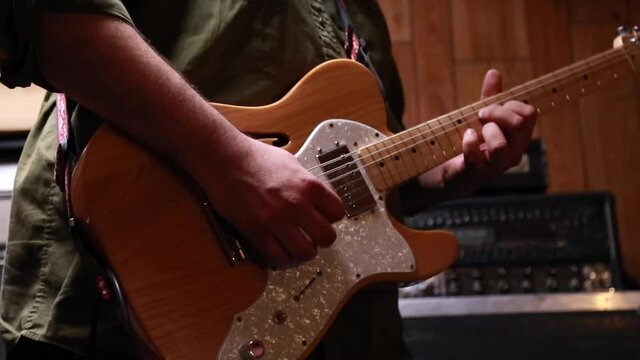 Guitarist playing a few guitar licks on his telecaster