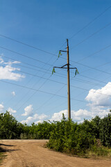 High voltage electrical lines and equipment against the blue sky.