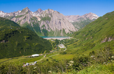 Fototapeta premium Aerial view of Riale alpine village and Morasco lake in Val Formazza, Piemonte, Italy