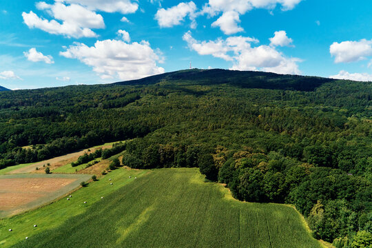 Aerial view of beautiful landscape in Mountains with forest and fields. Sleza mountain near Wroclaw in Poland. Nature background