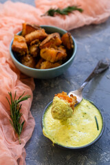 Ripe pumpkin fried in olive oil with cream sauce with turmeric