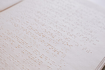 Background image of book for blind with tactile braille font, copy space - obrazy, fototapety, plakaty