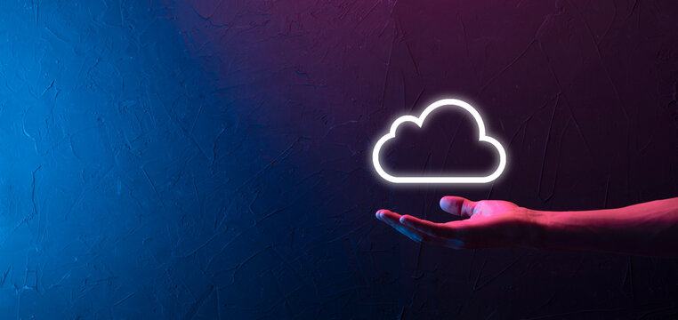 Hand holding icon cloud computing network and icon connection data information in hand. Cloud computing and technology concept.